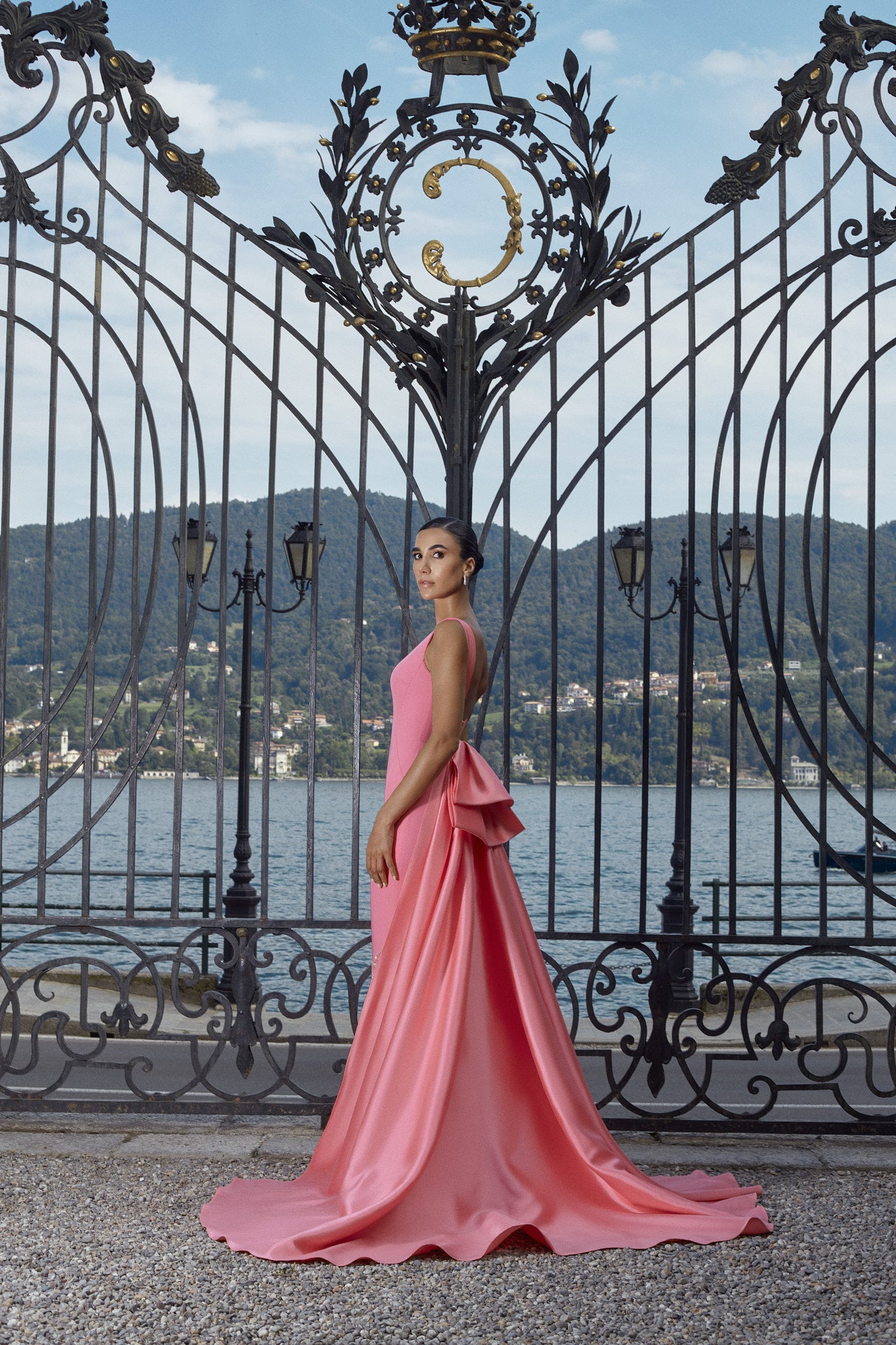 Women's pink dress with a tight design and a long train