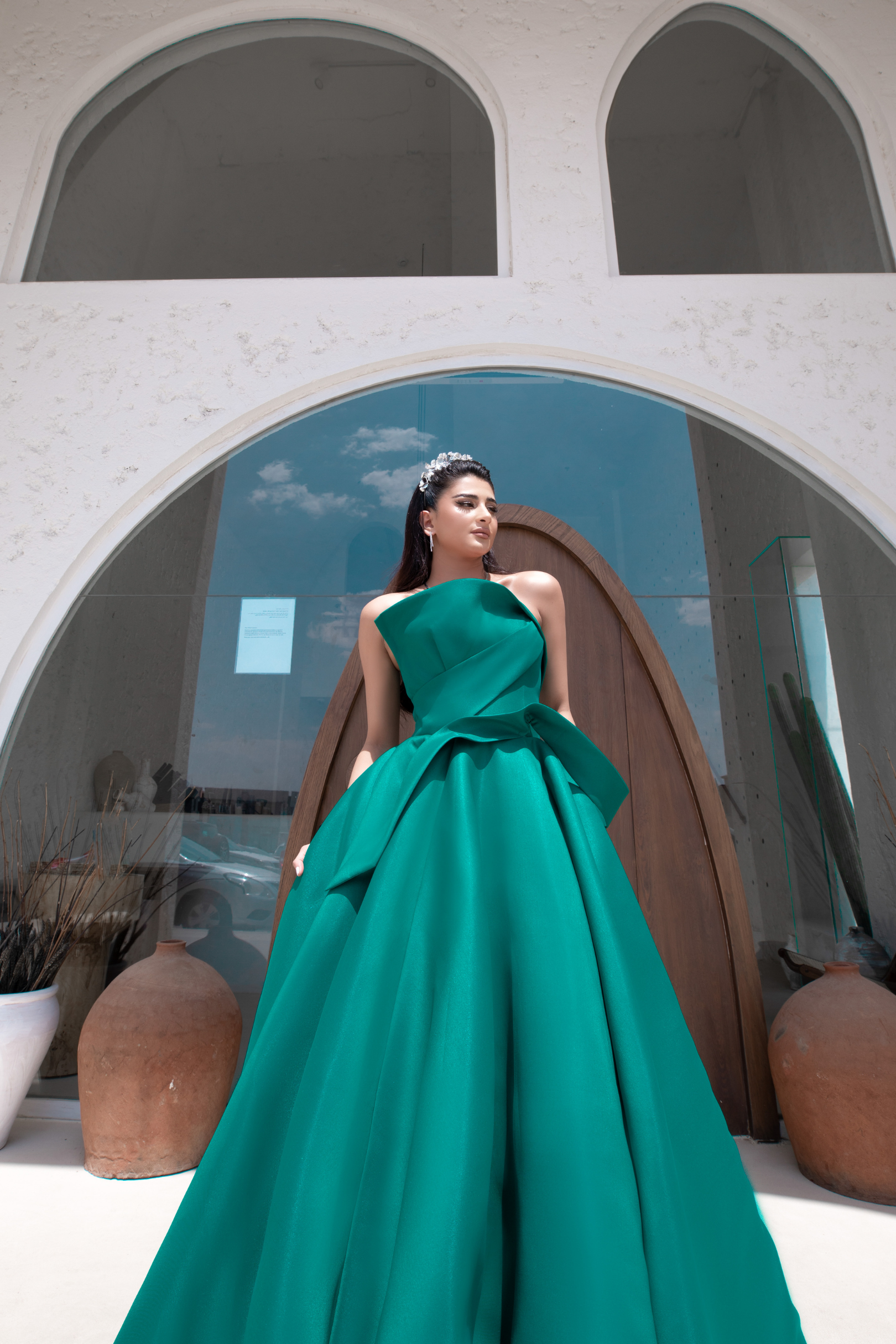 Green dress with a large bust and wide pleats