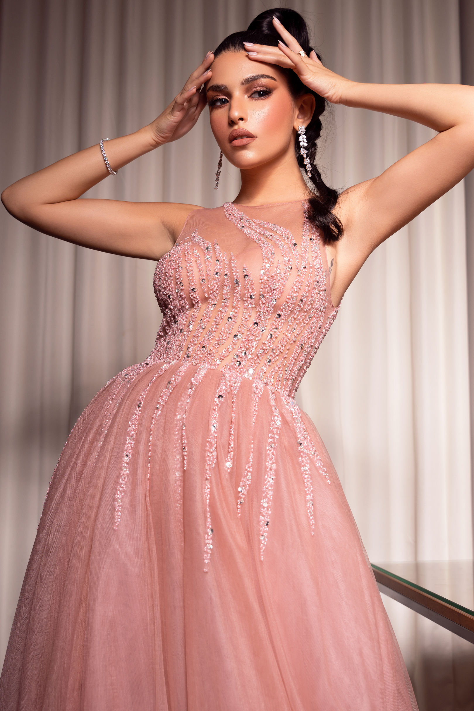 Pink evening dress with embroidered bodice and ruffles at the bottom