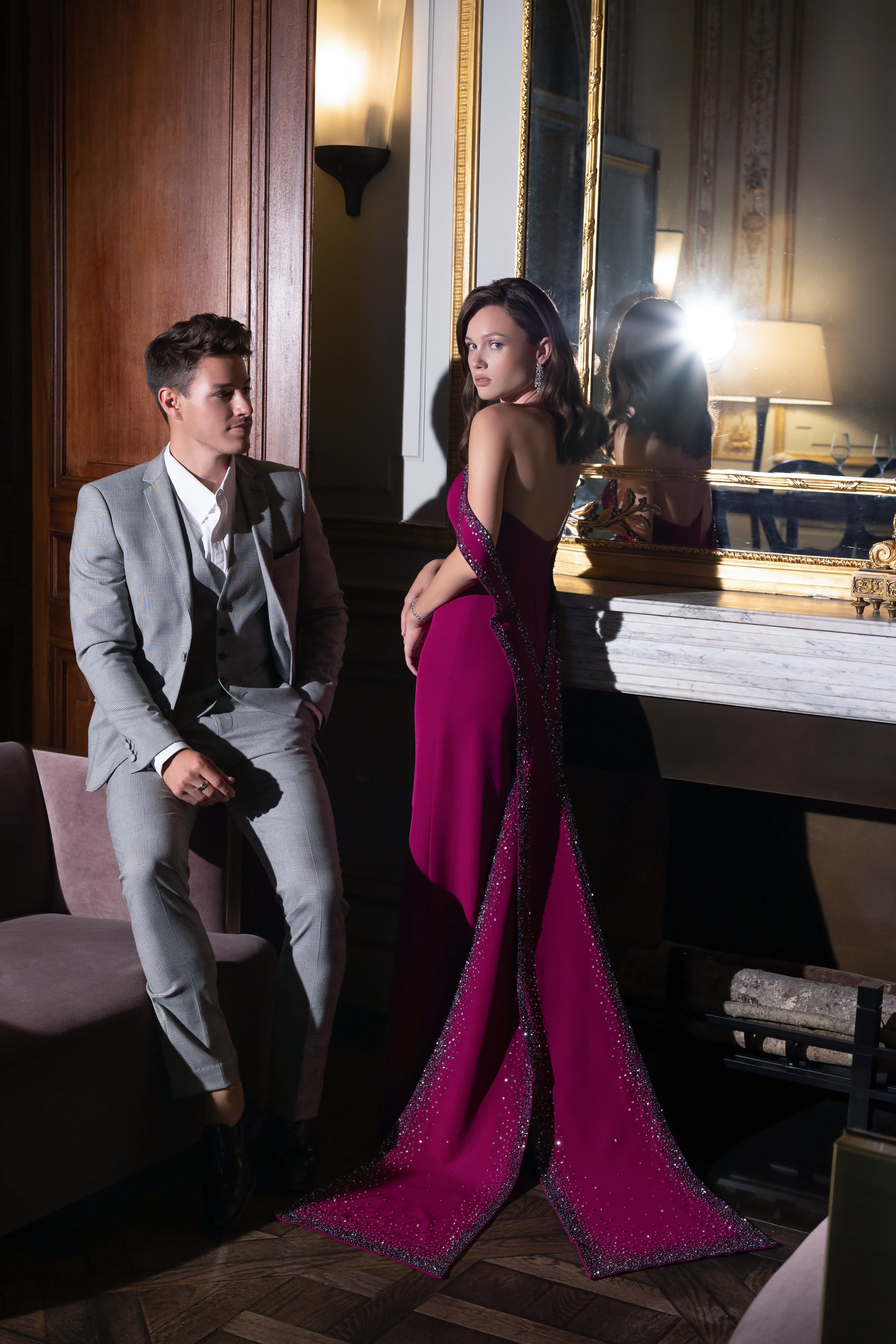 Burgundy evening dress with extended back sleeves decorated with sequins and beads
