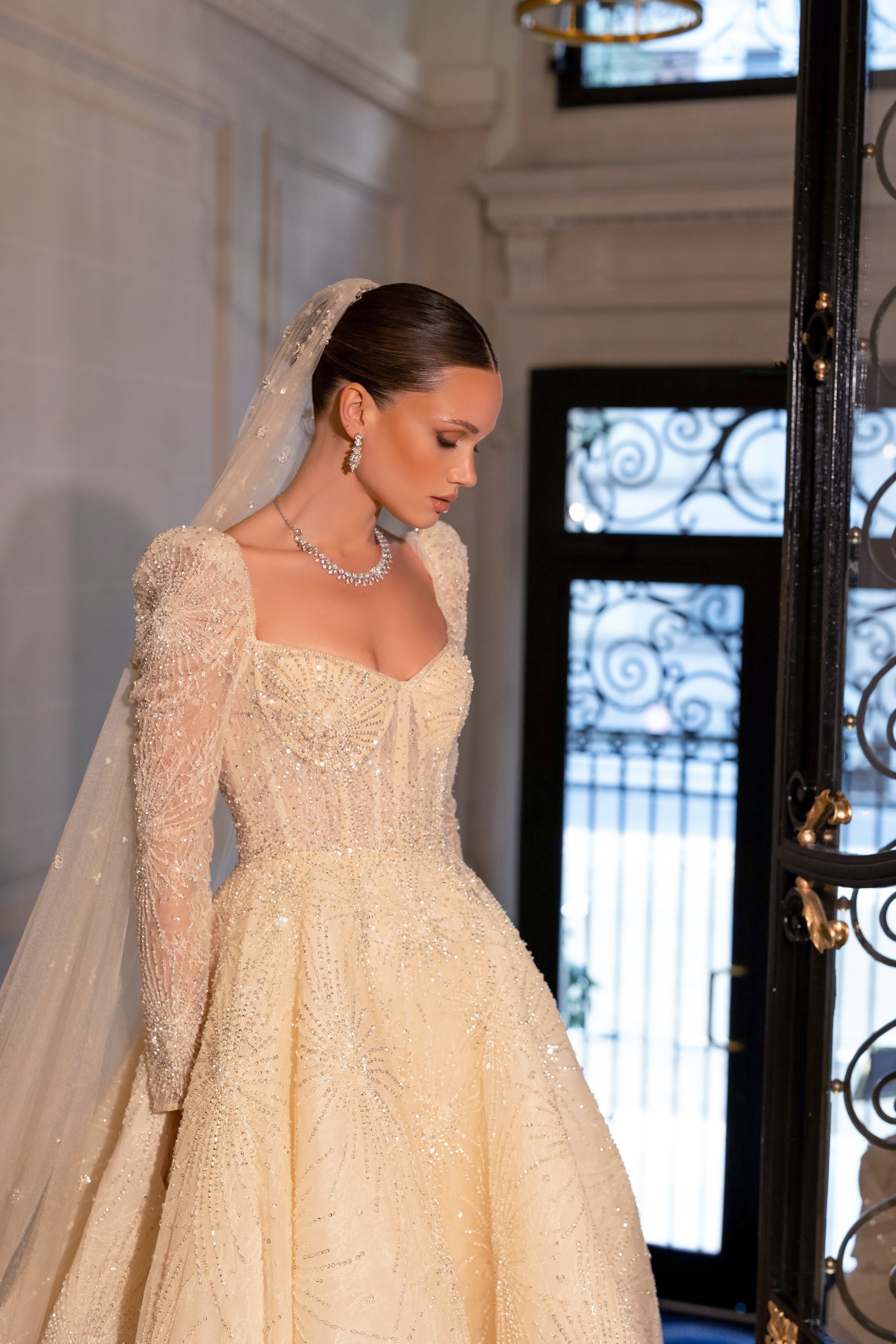 Long-sleeved wedding dress with long veil