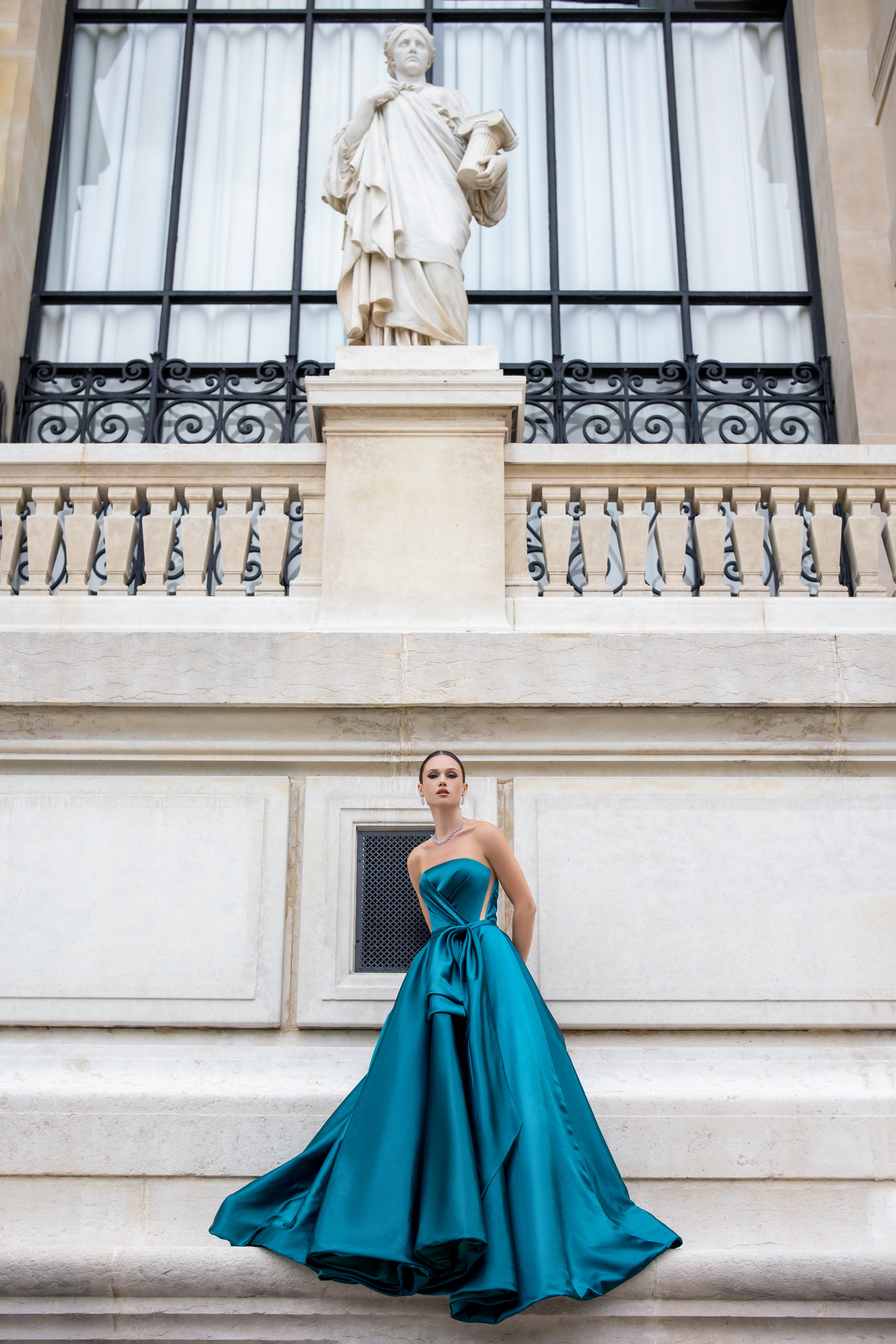 Blue dream dress with a sculpted waist and dangling pleats